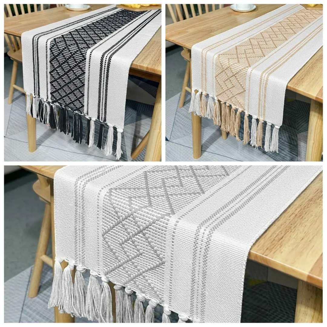 A table runner made of natural cotton linen fabric displayed on a table.