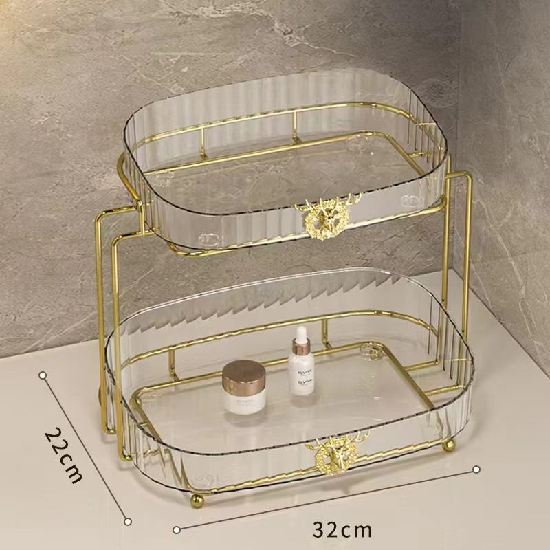 A two-tier clear acrylic organizer for stylish makeup, skincare, and perfume storage.