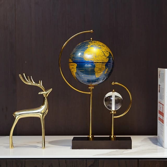 A crystal globe desktop ornament on a minimalist stand