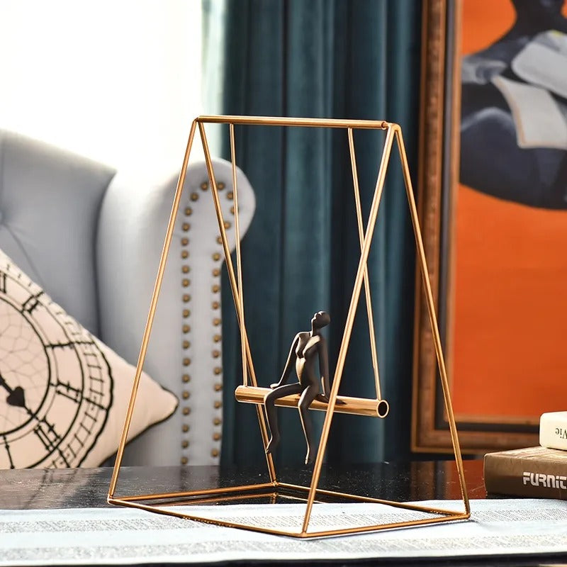 A collection of modern interior home décor pieces featuring silver-plated ceramics and abstract sculptural ornaments.