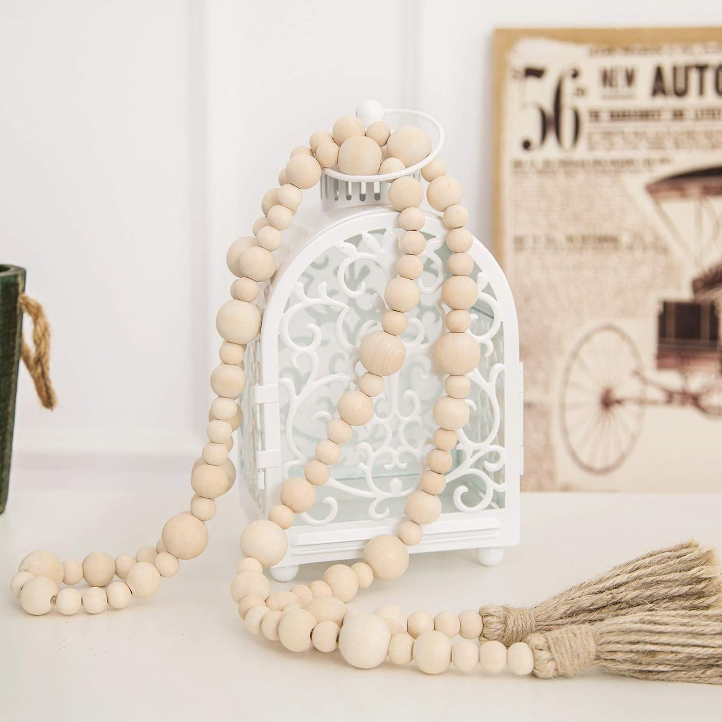 A handcrafted wooden bead garland with jute tassels for farmhouse style