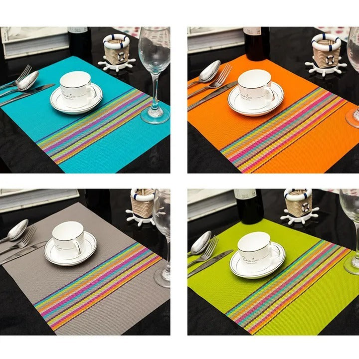 Four rectangular woven tablemats in teal, orange, grey, and lime green with colorful stripe accents