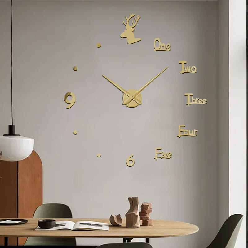 Large gold 3D mirror wall clock with Roman numerals, written numbers, and a deer head silhouette.