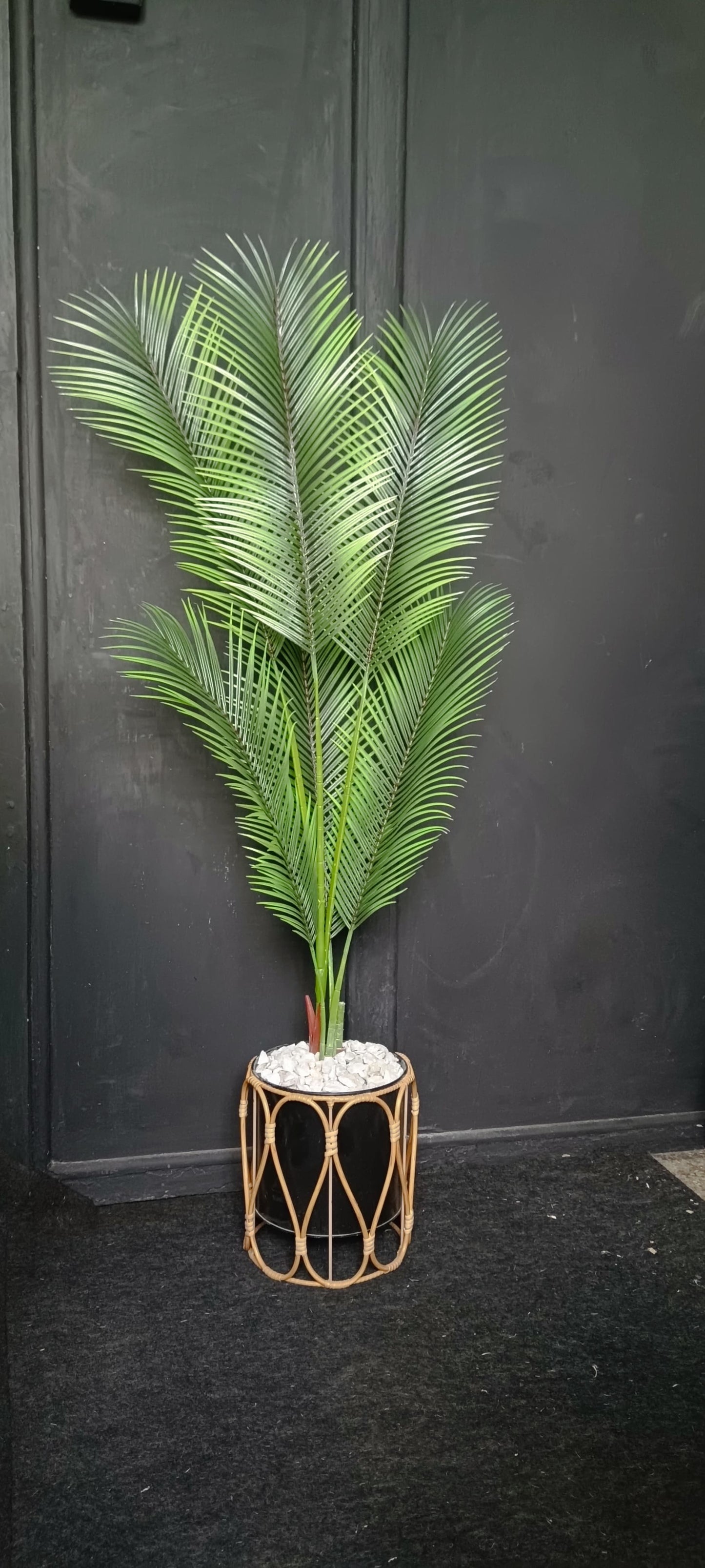 A 120 cm tall artificial palm tree with lush green fronds