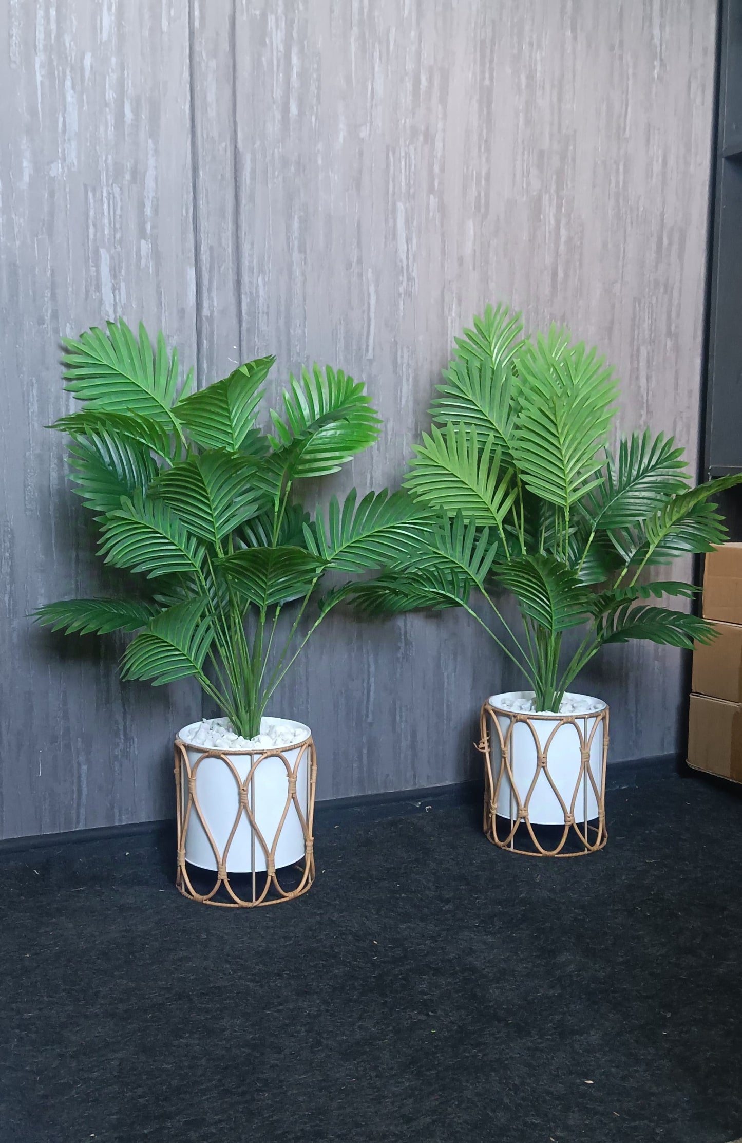 A 90cm artificial palm flower with large green fronds in a sleek metallic vase