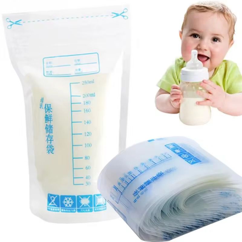 A roll of thirty disposable breast milk storage bags with measurement marks, shown next to a baby happily drinking from a bottle.