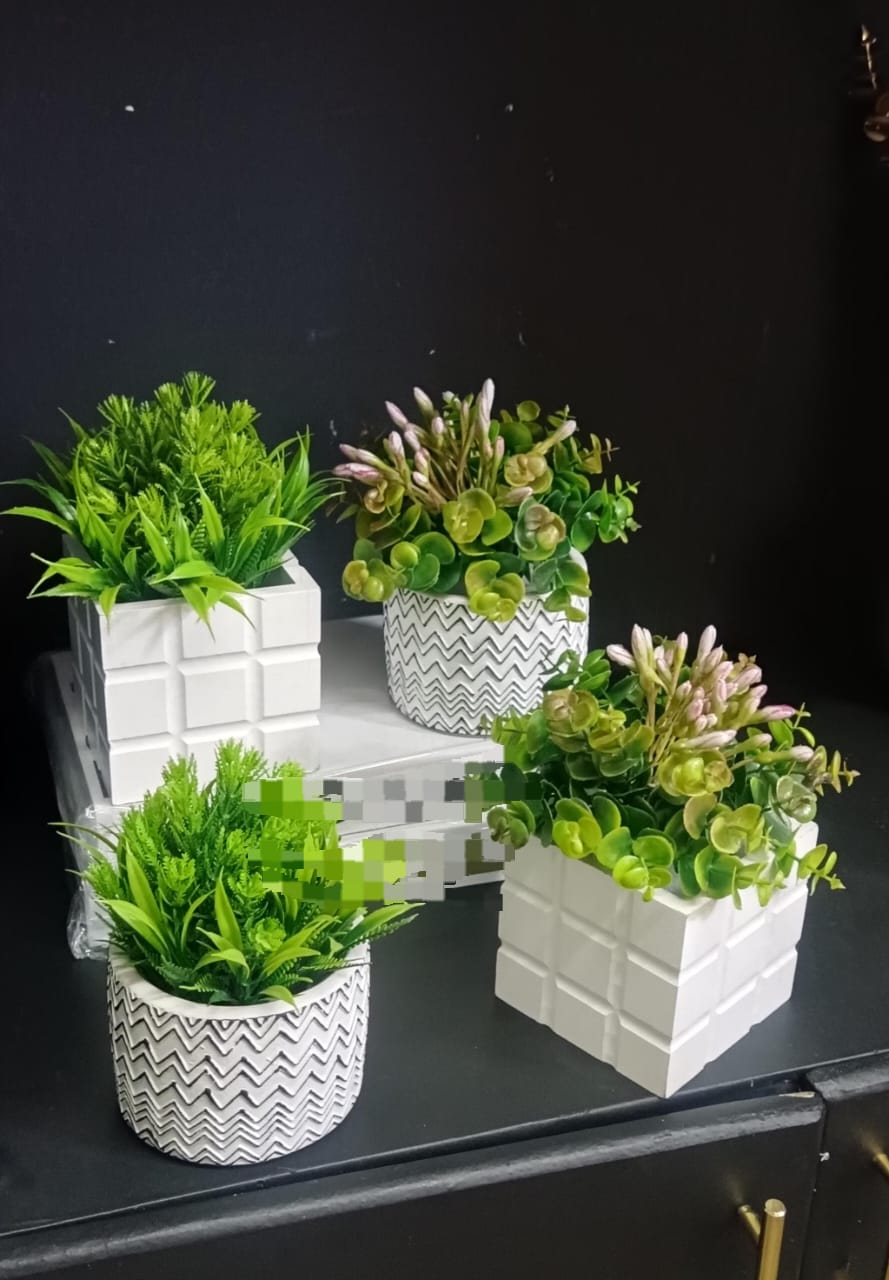 Artificial green flowers with lush leaves