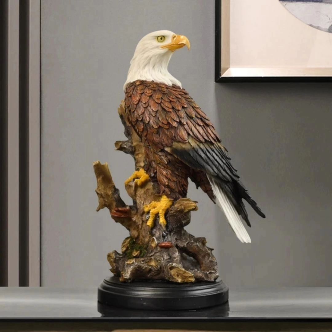 A realistic resin statue of a bald eagle perched on a tree stump with a black circular base.