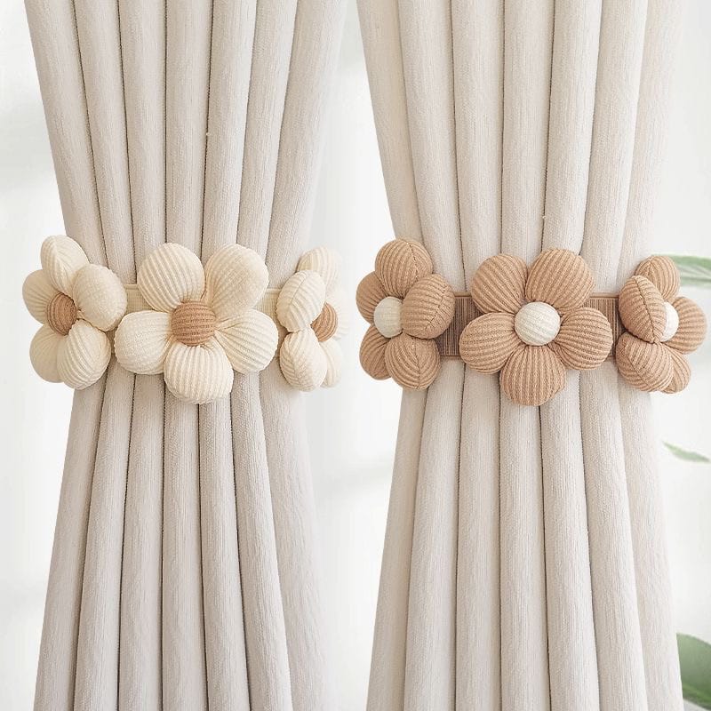 Handwoven fabric flower curtain tiebacks in cream and tan colors.