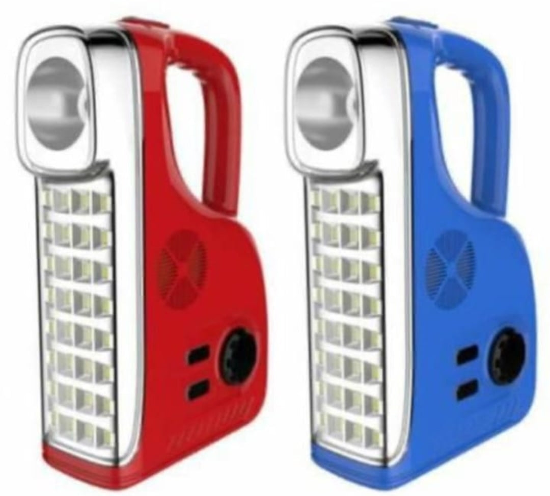 Two portable rechargeable emergency lamps with carrying handles, one in red and one in blue, featuring a front searchlight, a side LED panel, and a built-in radio speaker.