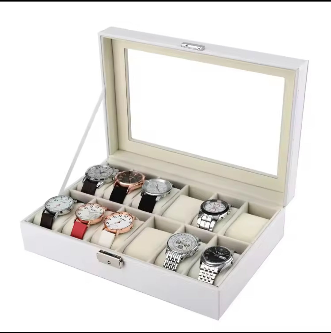 A white leather watch organizer case with a glass cover displaying multiple watches in various colors and styles.
