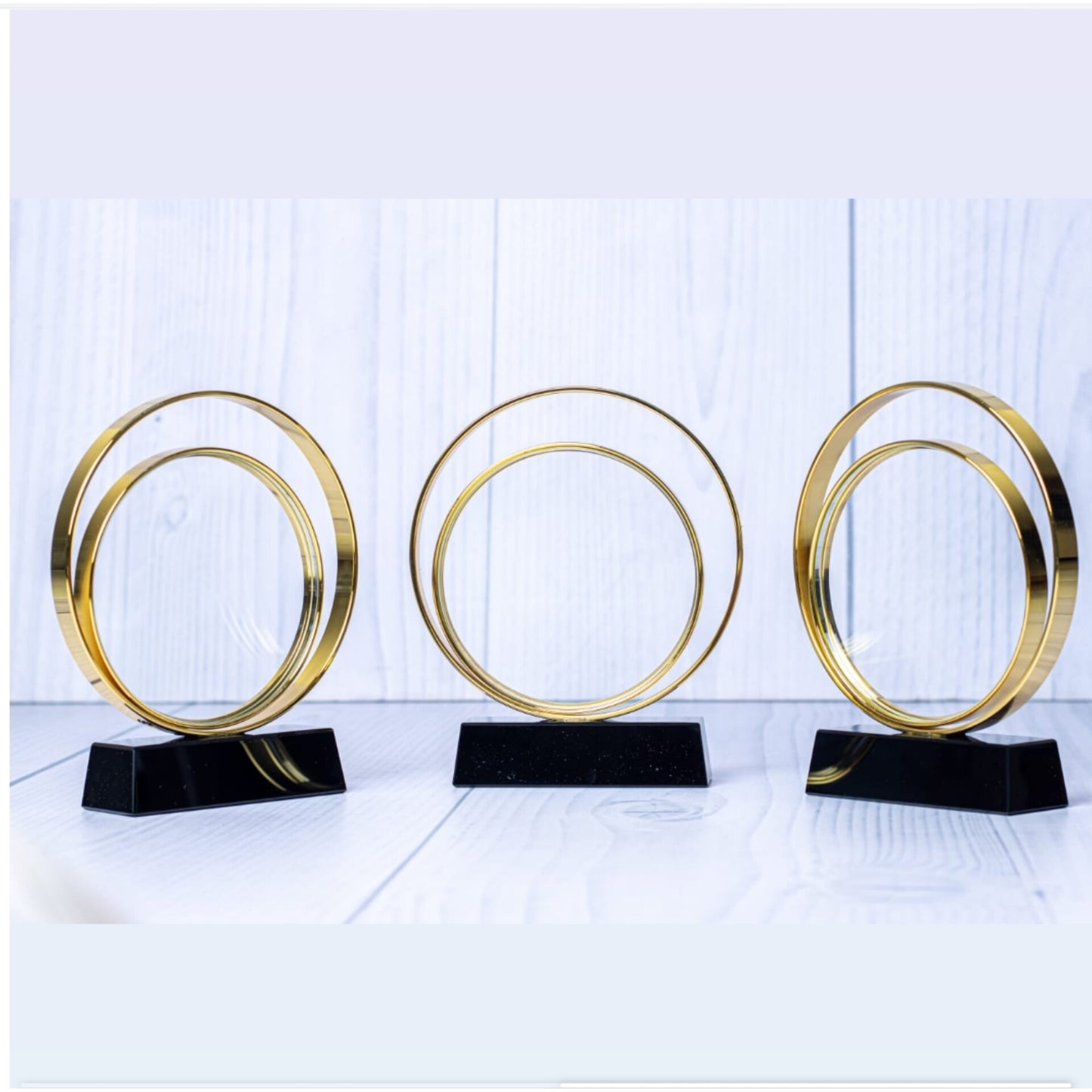 Crystal ring award with gold ring and black stand