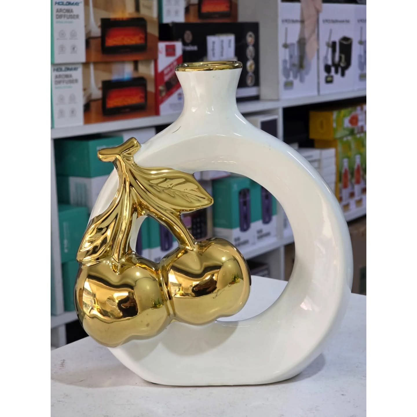 Modern ceramic vase with golden cherry