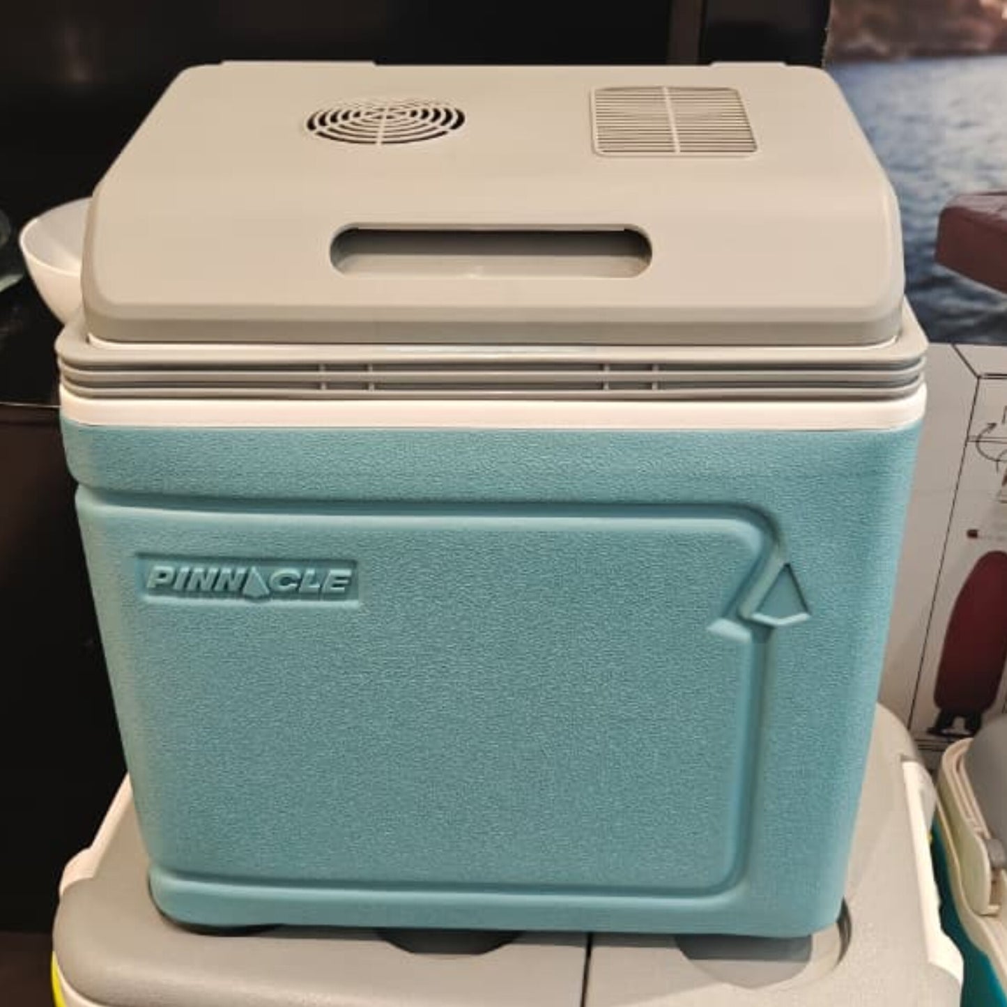 Pinnacle 30L electric cooler box with a sturdy lid and handle, designed for direct power use.