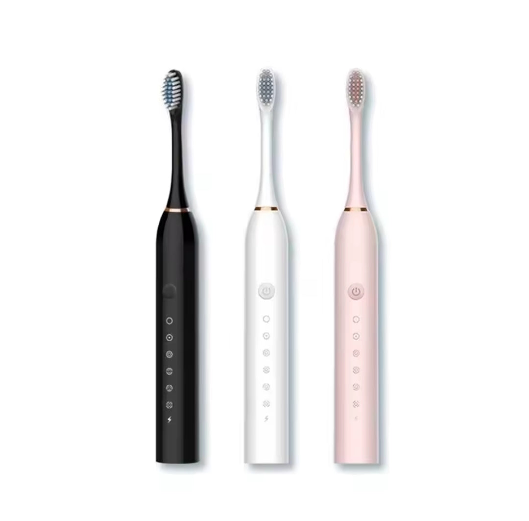 Three sonic electric toothbrushes in black, white, and pink, standing upright on a white background.
