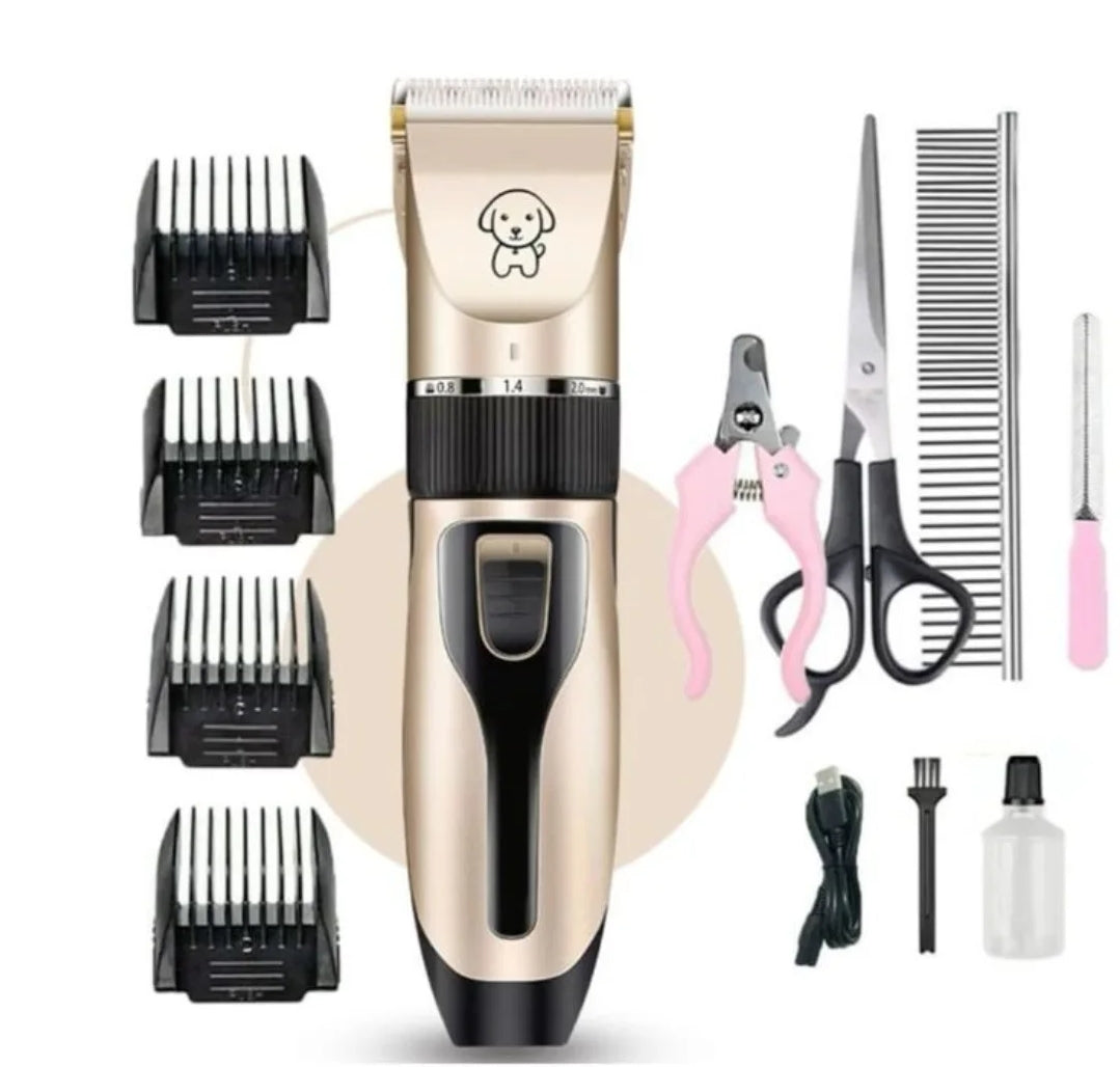 A pet grooming kit including a clipper with multiple attachments, scissors, clippers, and other grooming tools laid out on a white background.