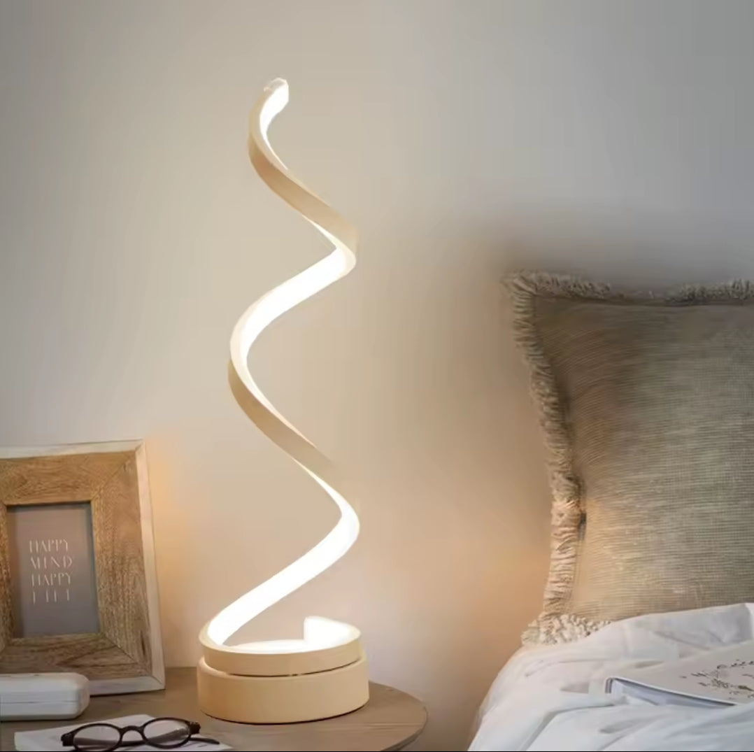A spiral rechargeable desk lamp with a curved illuminated strip.