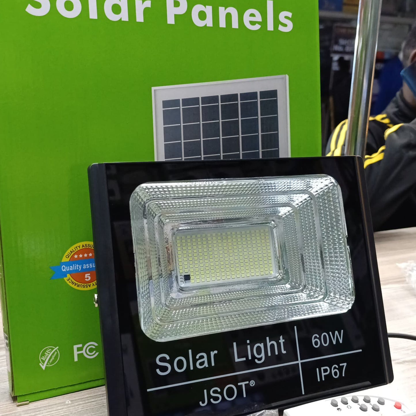 60W solar floodlight unit with a remote control.