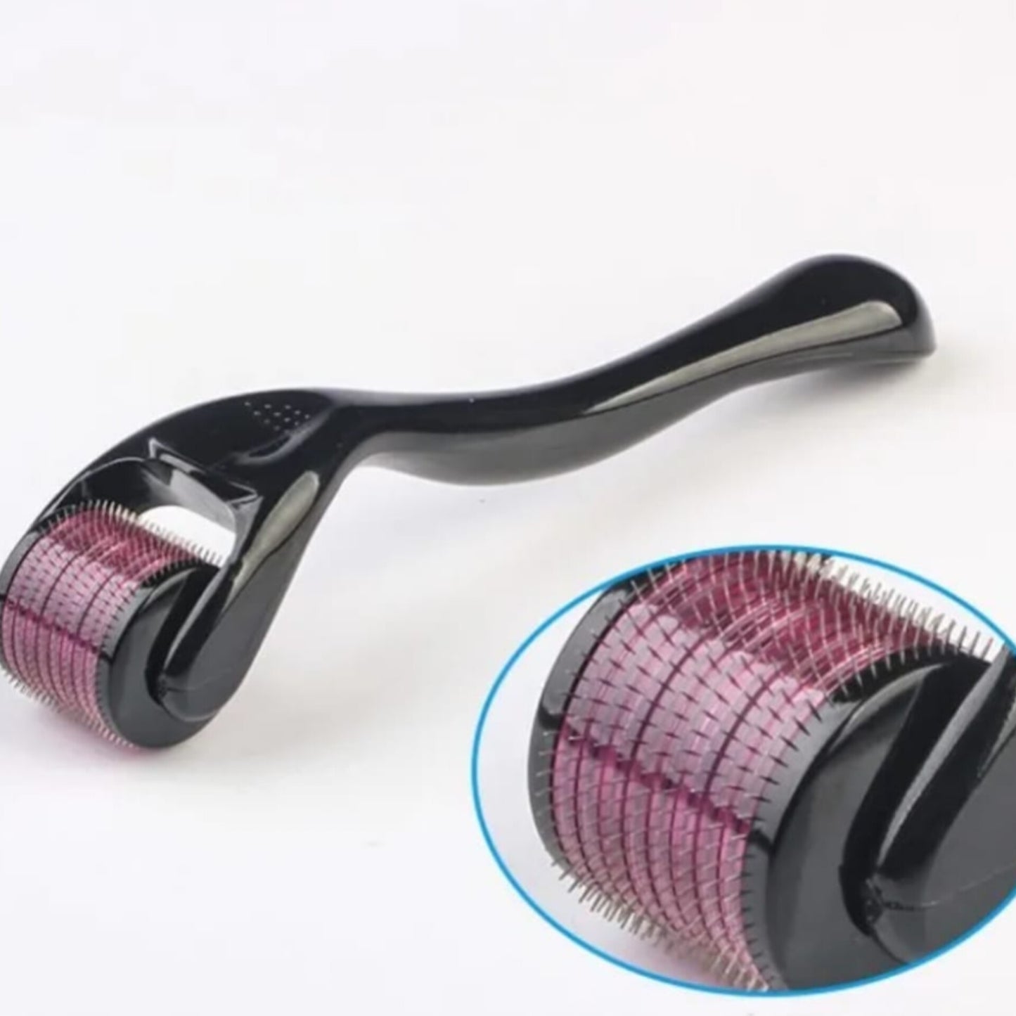 A black handled micro-needle derma roller with a close up view of the roller head showing its many small purple-tinted needles.