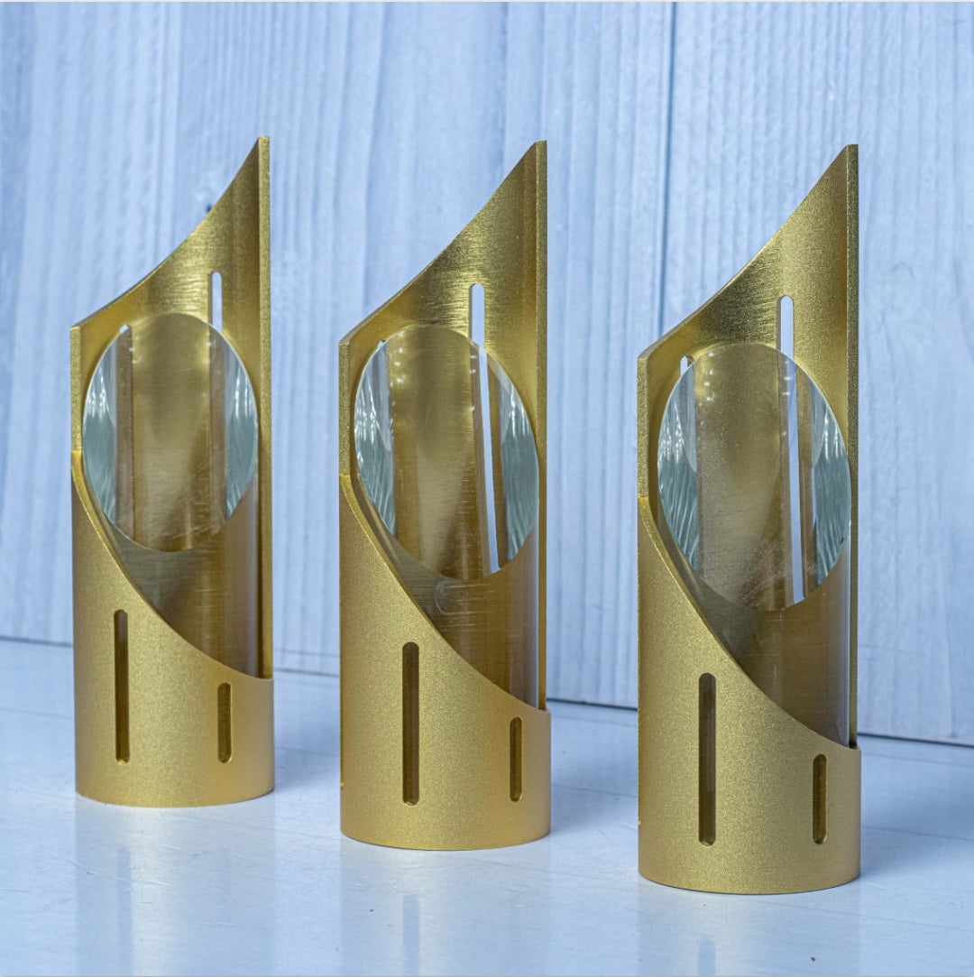 Golden cylindrical awards with angled tops and clear crystal gift trophy
