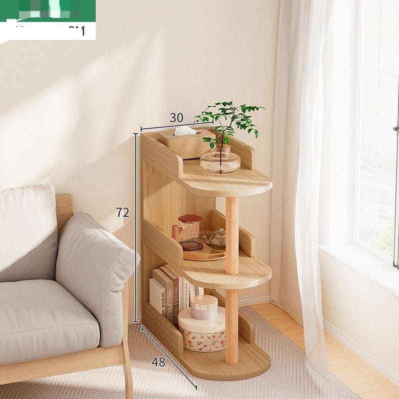 Light brown curved wood bedside table or bookshelf with three tiers.