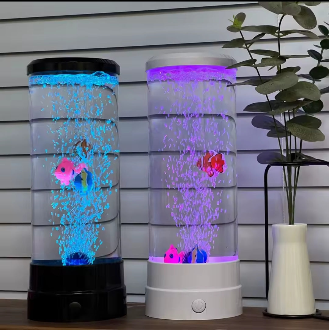 Two cylindrical bubble lamps with glowing blue and purple lights and floating artificial fish.
