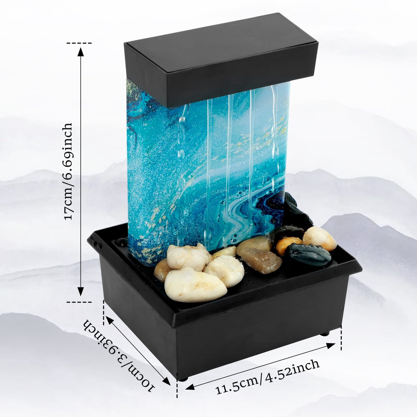 A small black tabletop fountain with a blue marbled waterfall panel and natural stones at the base.
