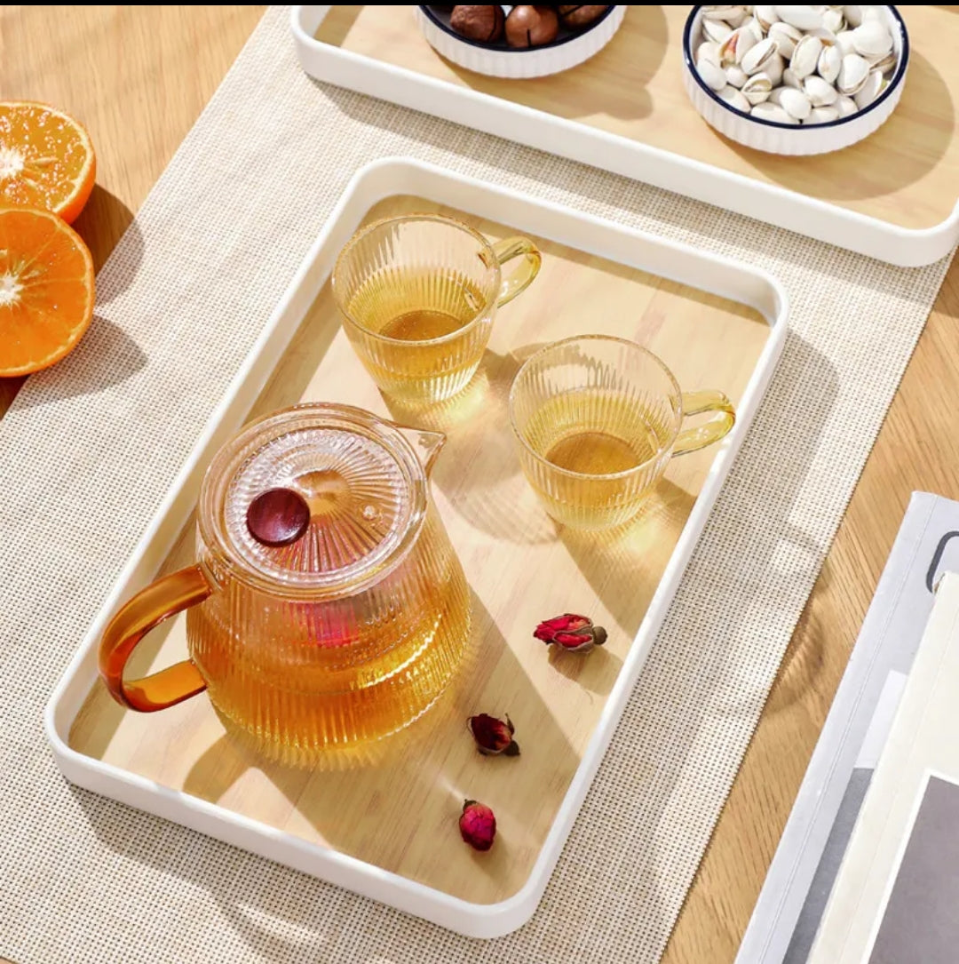 Rectangular wooden serving tray with a white frame