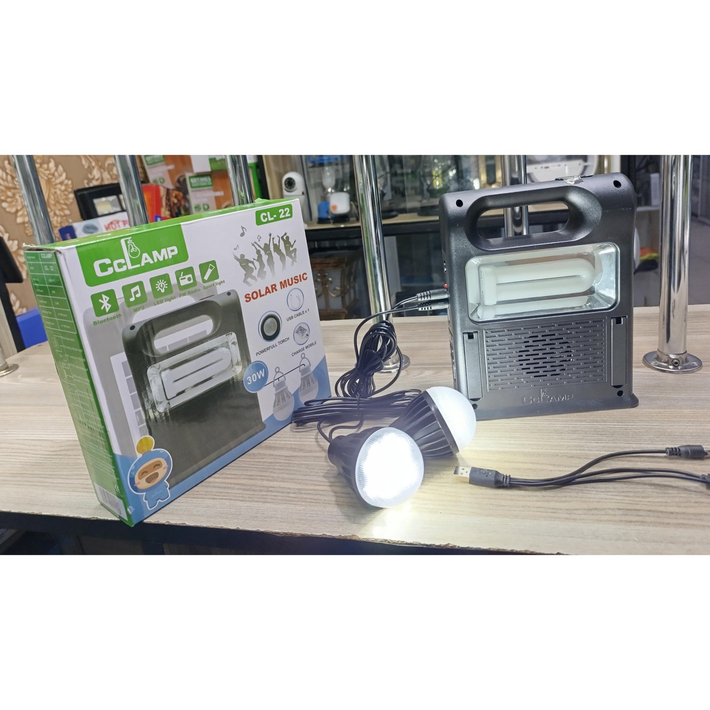 A black CcLamp CL 22 main unit with two glowing LED bulbs.