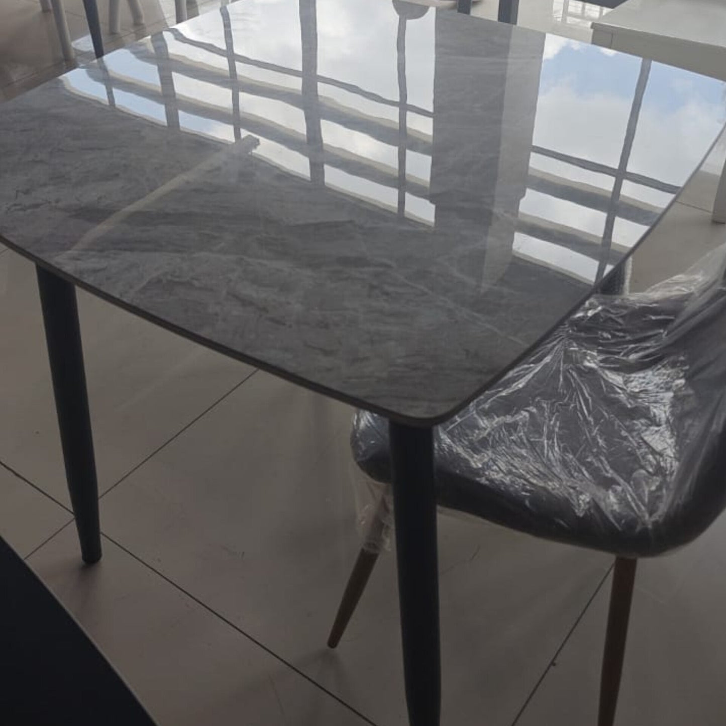 Marble table top with metallic legs