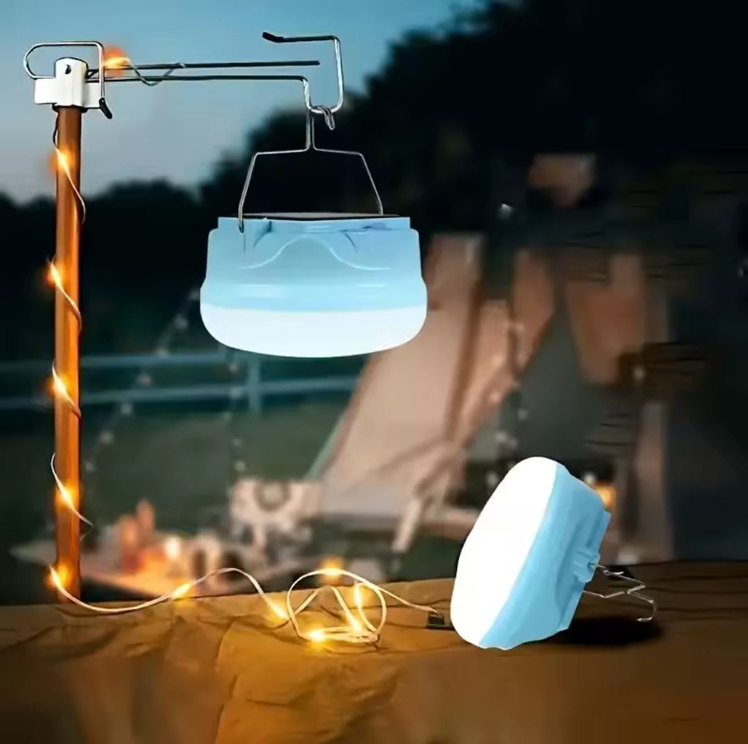 Blue and white circular solar LED camping bulb.