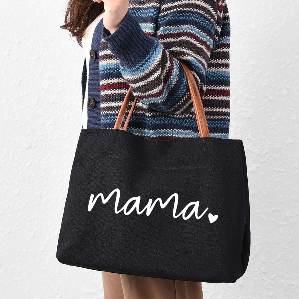 Black canvas tote bag with brown leather handles and the word 'Mama' printed in white script.