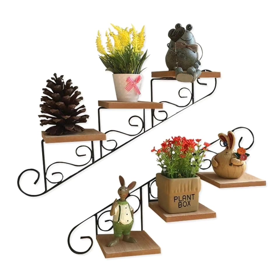 A six tier staircase wall shelf made of black wrought iron and wood.