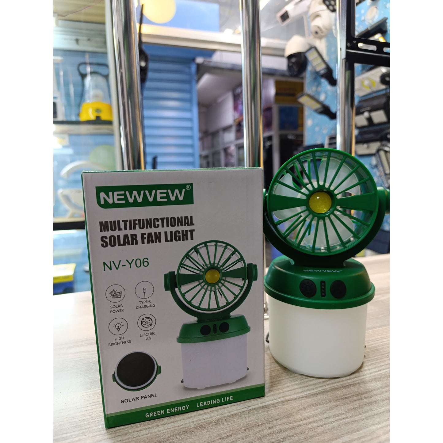 Green and white Newvew solar fan light with a built in LED base
