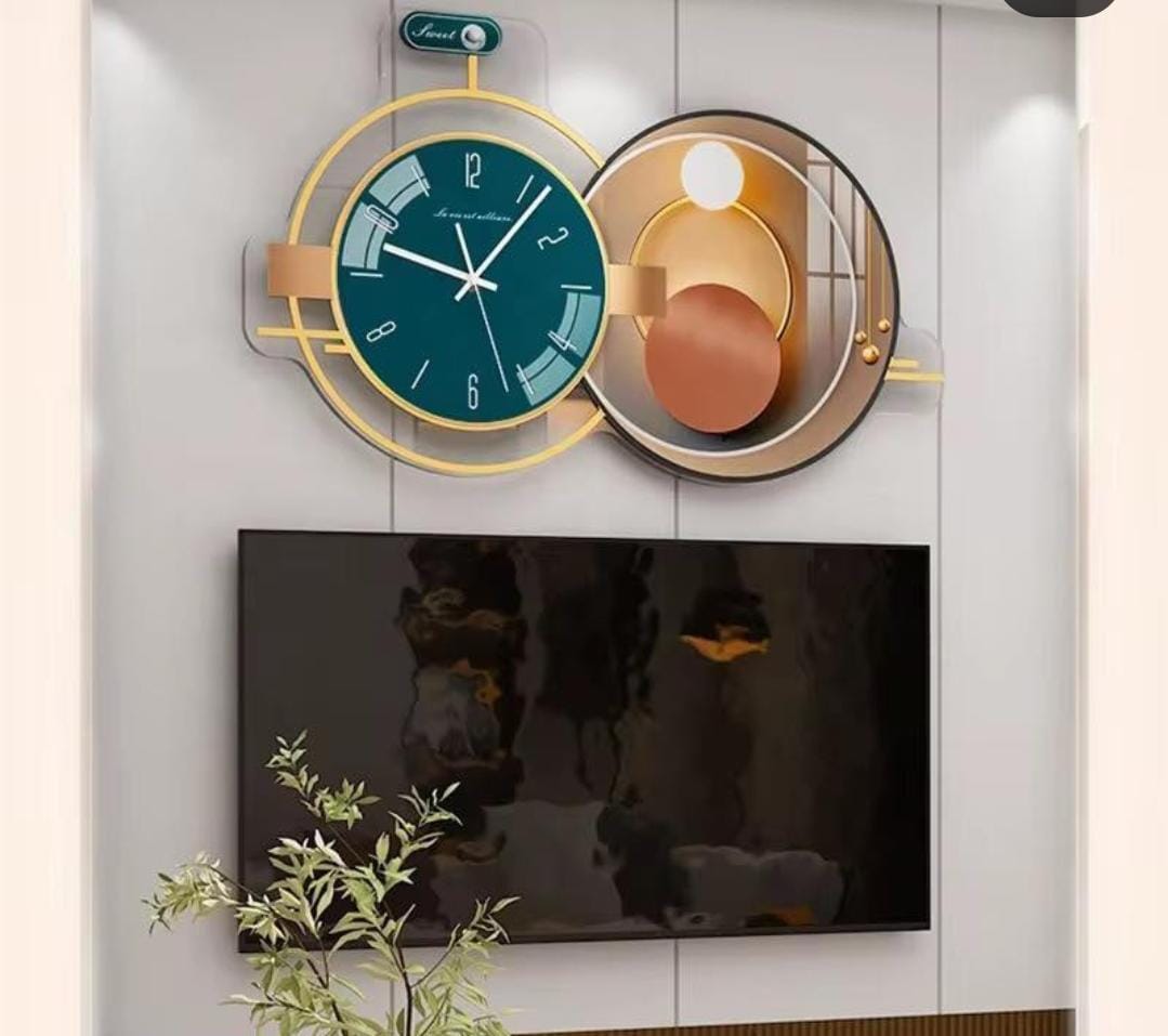 A large horizontal wall clock with a teal face and an adjoining gold geometric art panel.
