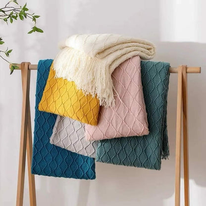 Knitted throw blankets with tassel