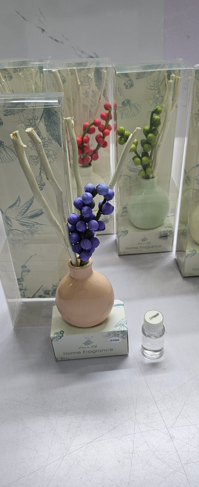 Decorate flowers, ceramic vase and reed diffuser