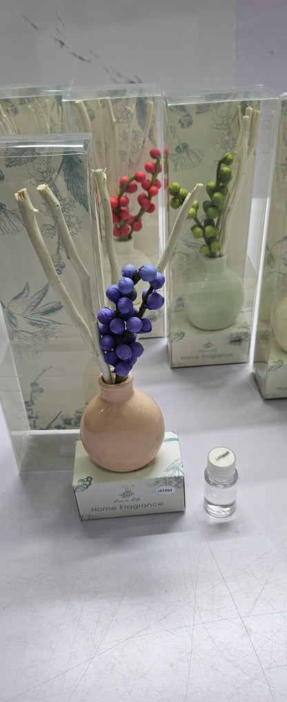 Decorate flowers, ceramic vase and reed diffuser