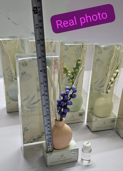 Decorate flowers, ceramic vase and reed diffuser