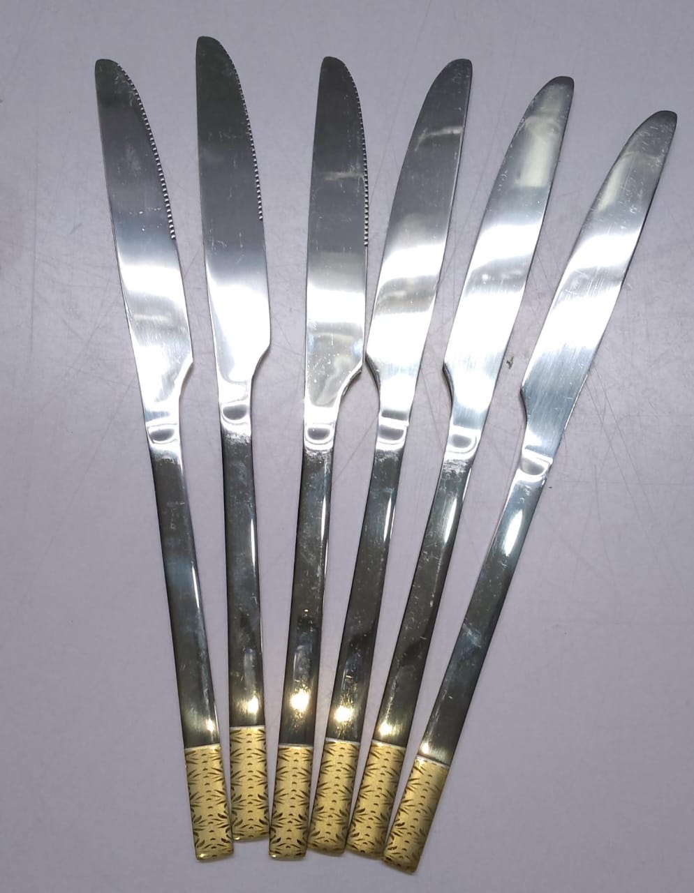 *Gold handle heavy stainless cutlery