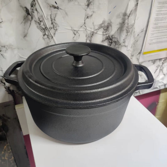 A heavy, black textured cast iron Dutch oven pot with two side handles and a matching lid with a black round knob.
