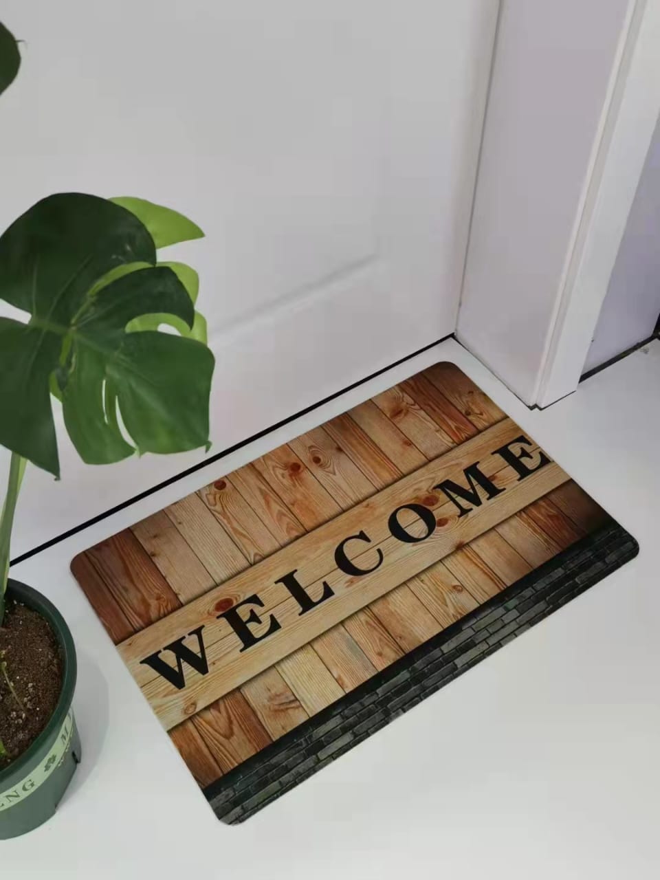 Door mat with rubber bottom