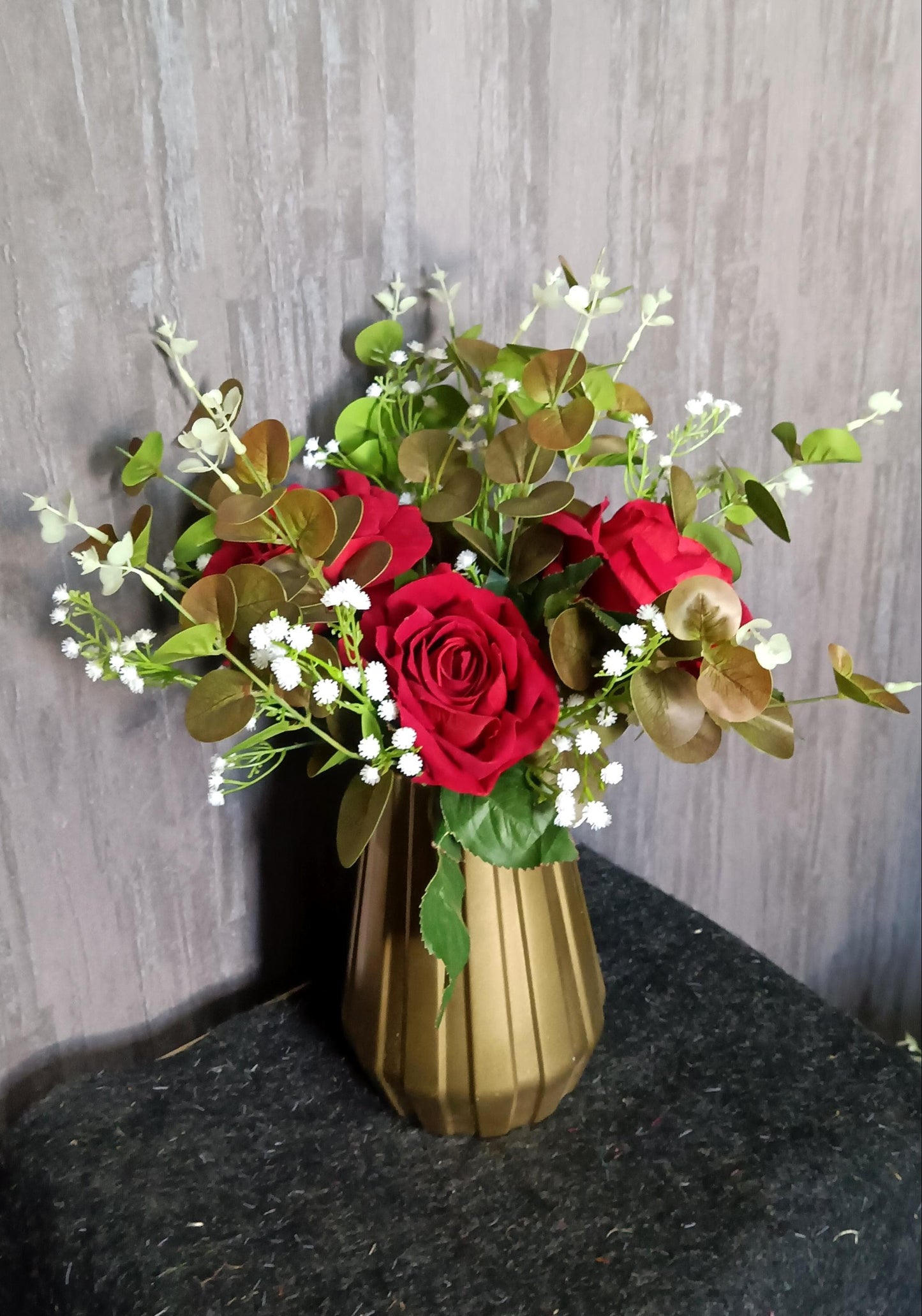 Artificial red rose with vase