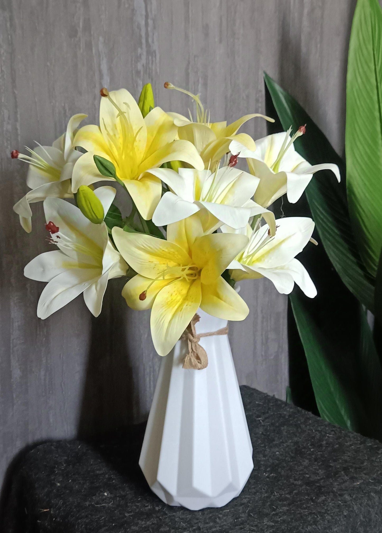 Tiger lilies with plastic vase