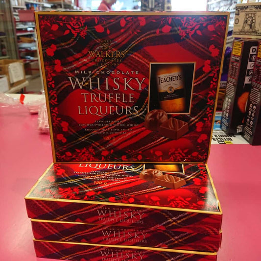 Stack of red and black tartan boxes of Walkers Milk Chocolate Whisky Truffle Liqueurs.