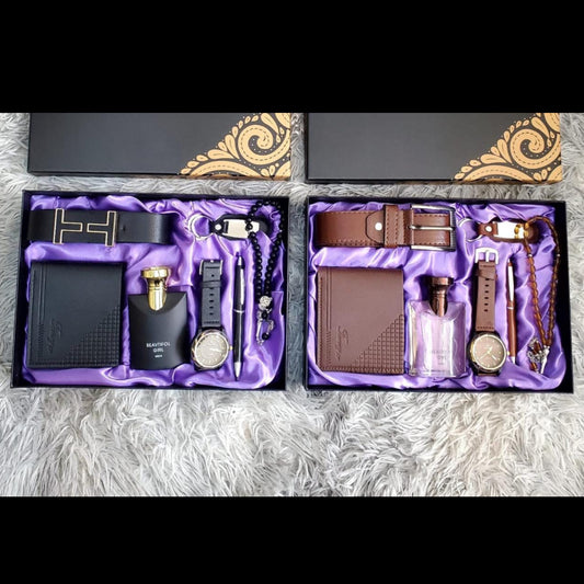 Two men's luxury gift boxes with purple satin lining, each containing a belt, wallet, watch, perfume bottle, pen, bracelet, and key holder.