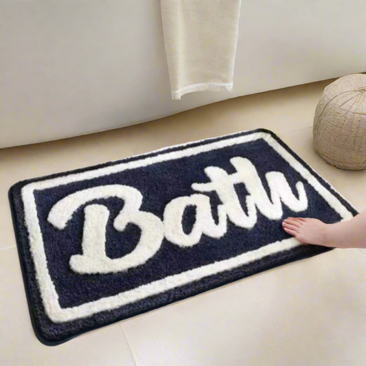 Absorbent bath door mat