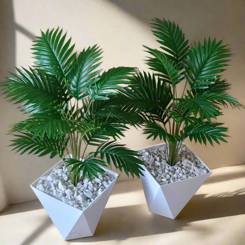 Artificial potted palm tree with vase and pebbles