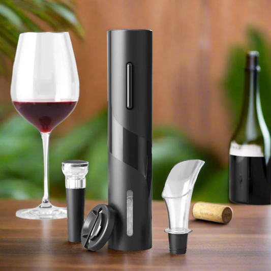 An electric wine opener set in black, including a tall cylindrical opener, a wine pourer aerator, and a wine stopper, displayed next to a glass of red wine.