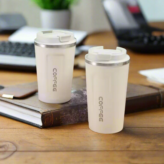 Two creamy white thermal coffee mugs with stainless steel trim and white lids.